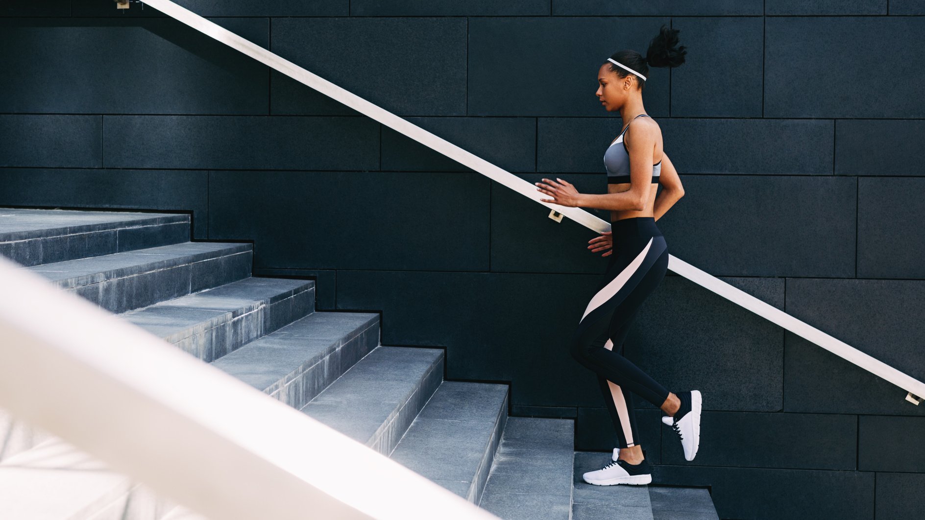 Woman Running on Stairs